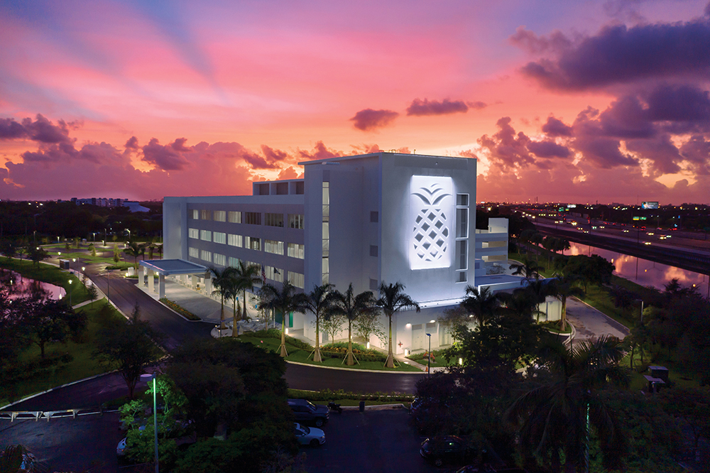 Nighttime exterior shot of Baptist Health South Florida, which is located in the Greater Fort Lauderdale Region.