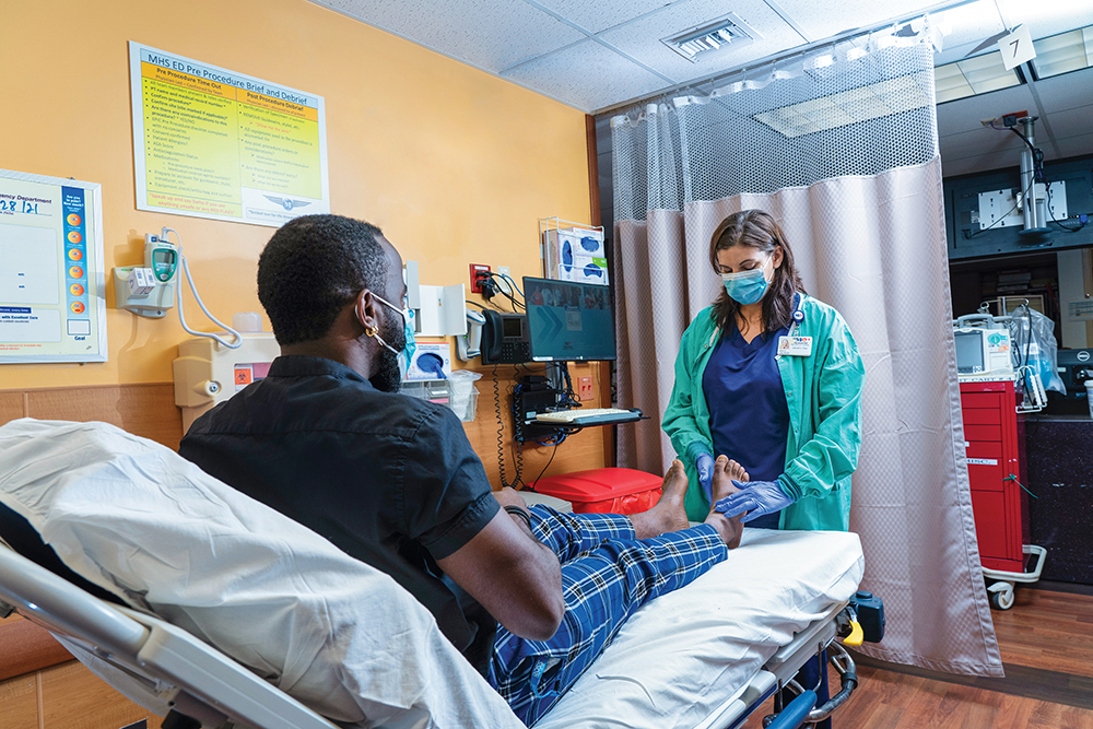 Nurse checks on a patient at one of Memorial Healthcare Systems locations in the Greater Fort Lauderdale region of Southern Florida.