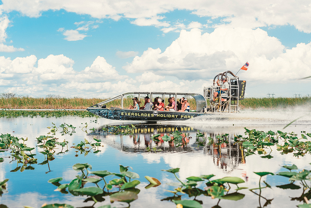 People ride on a water taxi at the Everglades Holiday Park, which is located in the Greater Fort Lauderdale region of Florida.