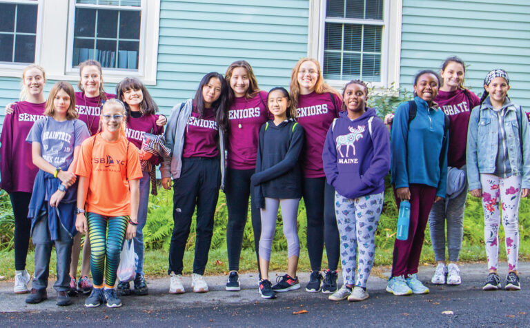 Students stand outisde of The Woodward School in Quincy, MA.