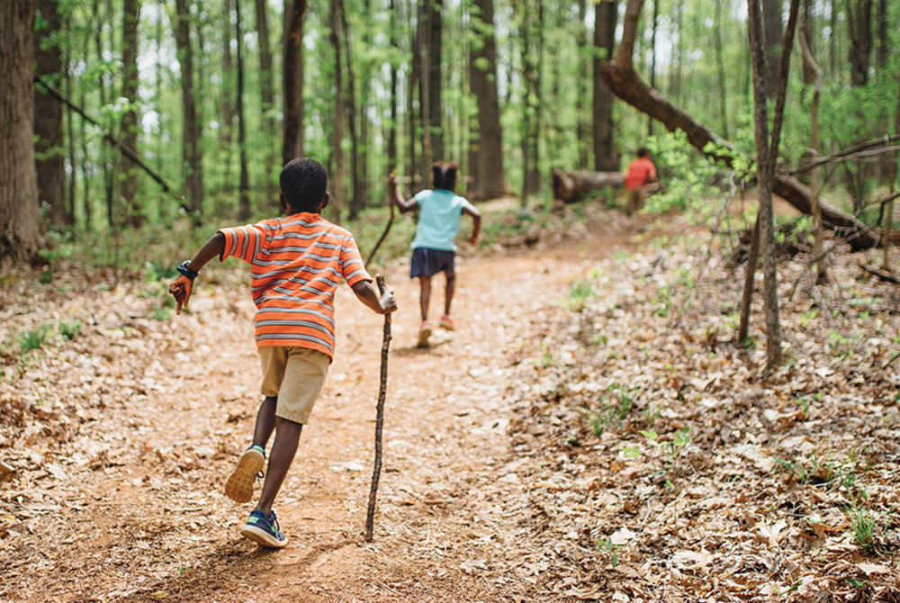 Children run along a path at James Madison Montpelier in Central Virginia.