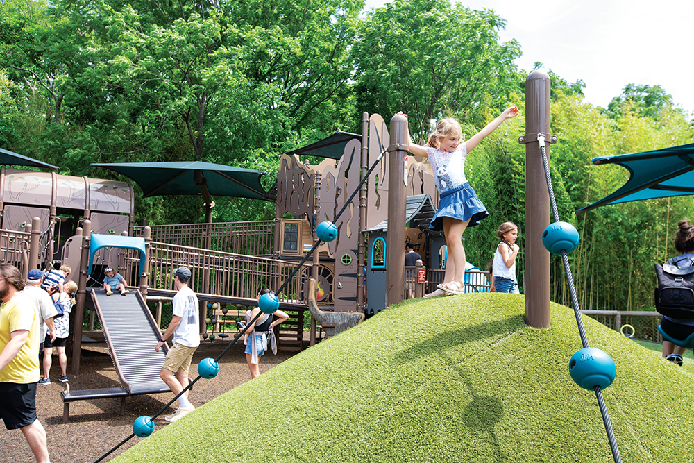 Aubrey Wilcox, 7, plays at the newly remodeled Jungle Gym playground at the Nashville Zoo in Nashville, Tennessee.