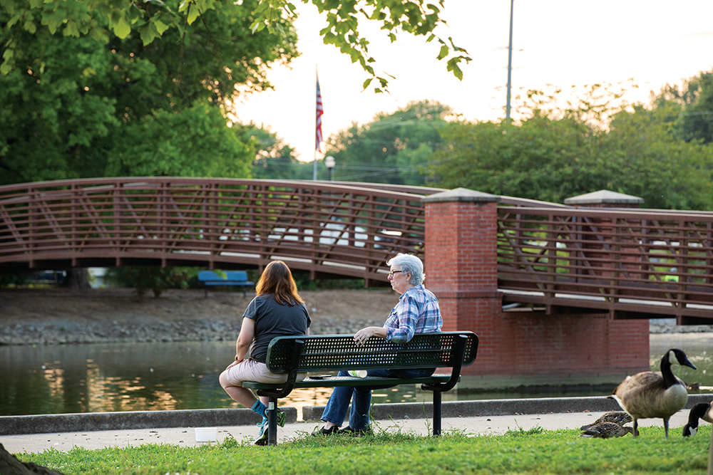 People sit along the water at Memorial Park in Hendersonville, Tennessee, which is located right outside of Nashville.