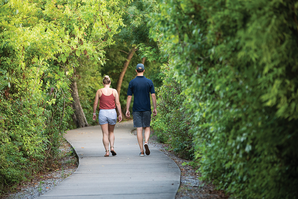 People walk down a trail at Memorial Park in Hendersonville, Tennessee, which is located right outside of Nashville.