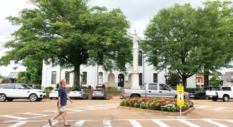 Scenes from Oxford, Mississippi - A man walking through the downtown square.