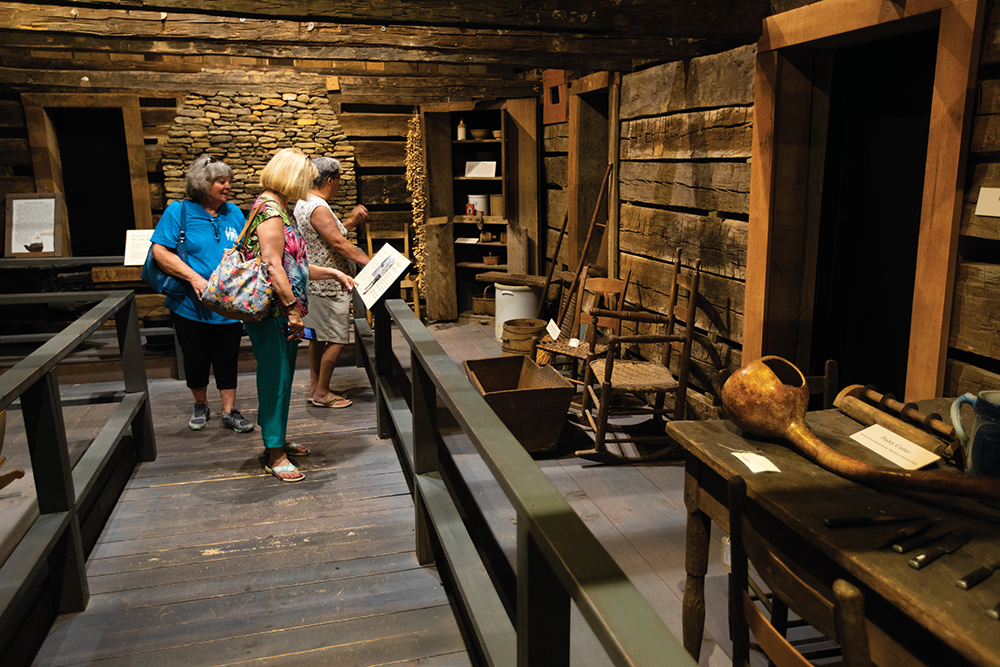 Visitors view the historical exhibits at the Great Smoky Mountain Heritage Center in Townsend, Tennessee in Blount County.