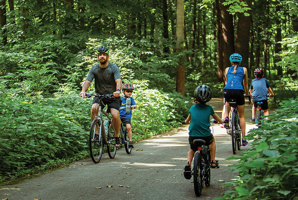 Families ride along the trails at Rolling Prairie Trail in the Cedar Valley region of Iowa.