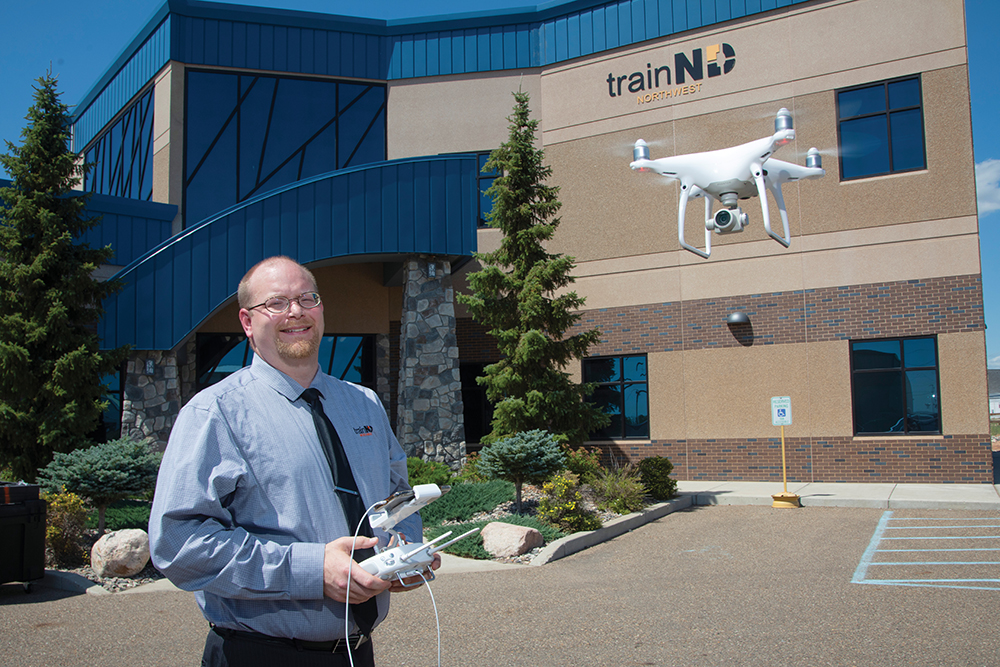 Man demonstrates how a drone works outside of the trainND Northwest facility in Williston, ND.