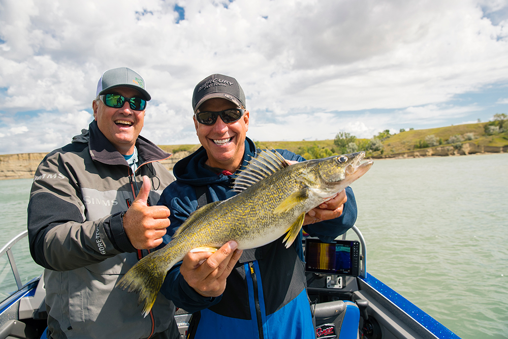 Men pose with a fresh catch from Government Bay, on Lake Sakakawea, in North Dakota.