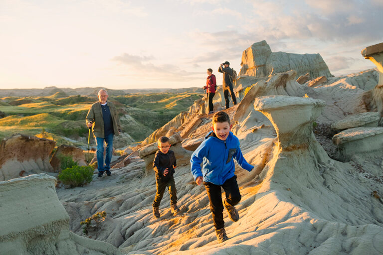 Family hikes through Theodore Roosevelt National Park in North Dakota.