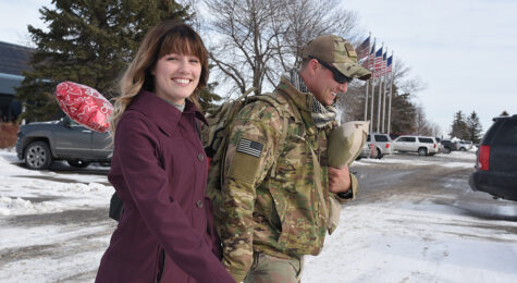 Staff Sgt. Zak Bergstrom, of the 119th Security Forces Squadron, North Dakota Air National Guard, walks to his car with his wife as she greets him at Hector International Airport, Fargo, N.D., upon his return home from a six-month deployment to southwest Asia Jan. 18, 2018. (U.S. Air National Guard photo by Senior Master Sgt. David H. Lipp) Credit North Dakota National Guard