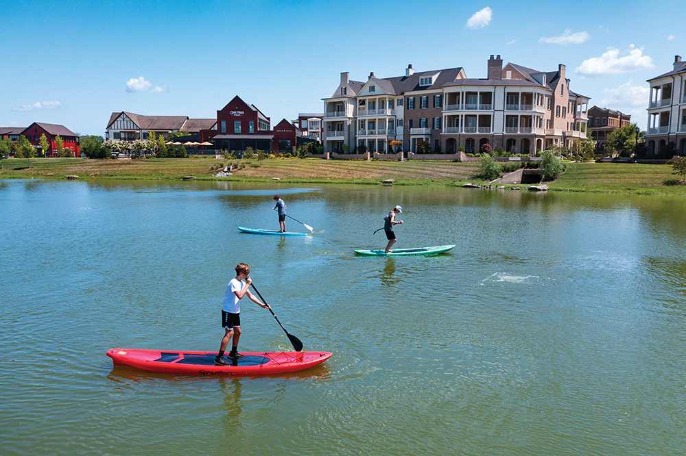 Paddle boarders on the lake at the Westhaven development in Franklin. Franklin is located in Williamson County, TN.