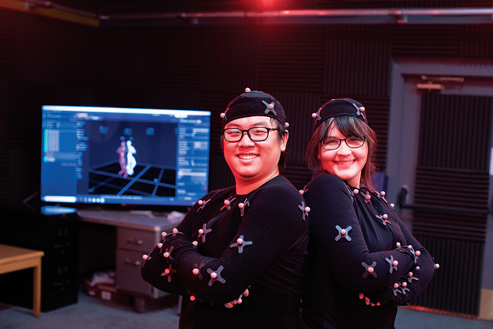 Film students Kevin Fan and Jenna Ziwlkiewicz perform movements in the motion capture lab while wearing special suits covered in sensors at the Creative Media Institute For Film and Digital Arts at New Mexico State University in Las Cruces, New Mexico.