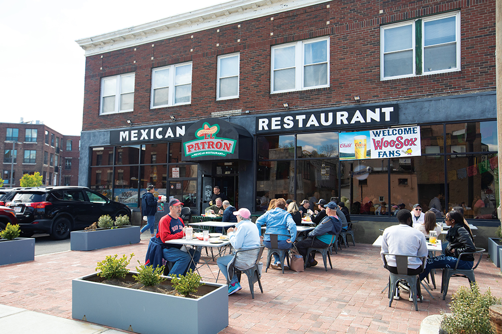 People eat outside at El Patron Mexican Restaurant in the Canal District in Worcester, MA.