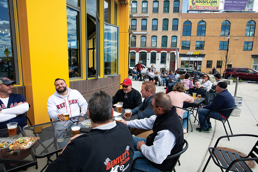People eat outside at the Wachusett Brew Yard in the Canal District in Worcester, MA.