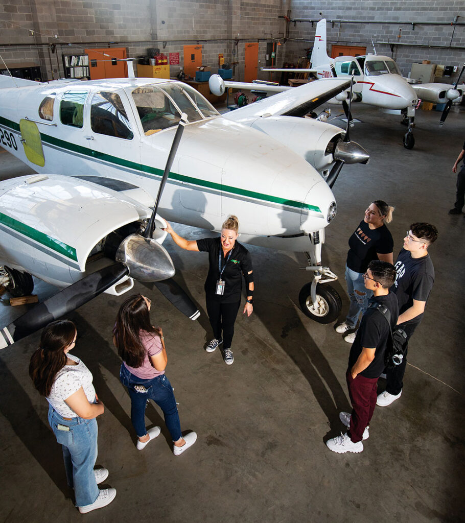 Instructor Andrea Fitzsimmons shows students a Beechcraft E-50 the school uses for the Aviation Maintenance Technology program at Eastern New Mexico University-Roswell.