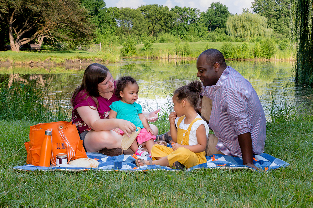 A family enjoys greenspace in Champaign, IL.