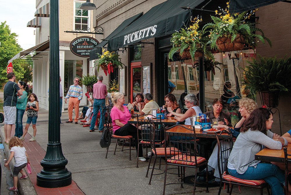 People eat outside at Puckett's Grocery in downtown Franklin, which is located in Williamson County, TN.