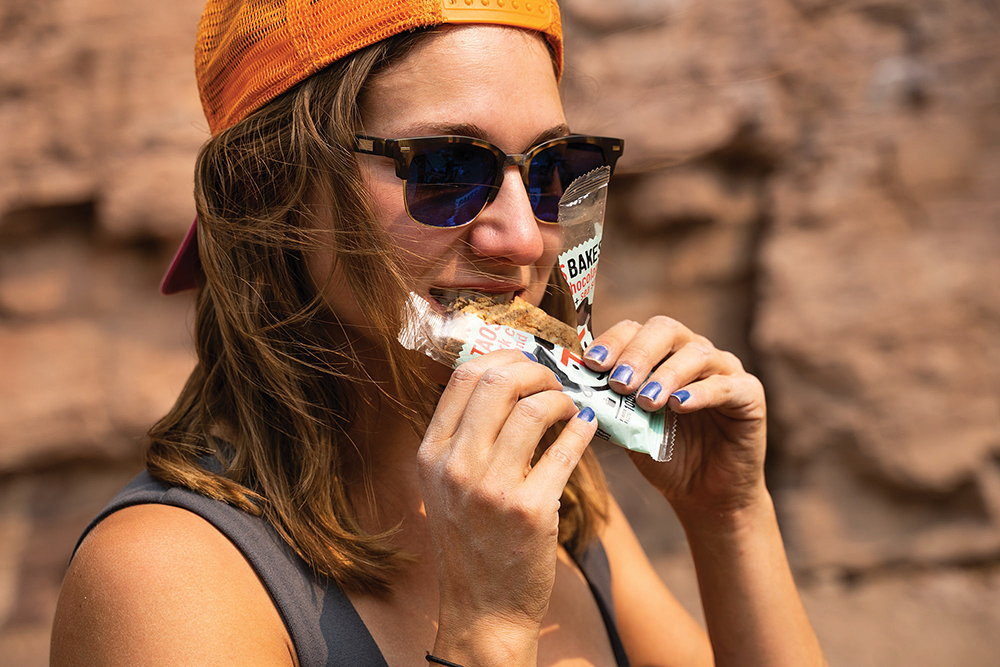 Woman enjoys a snack from Taos Bakes in New Mexico.