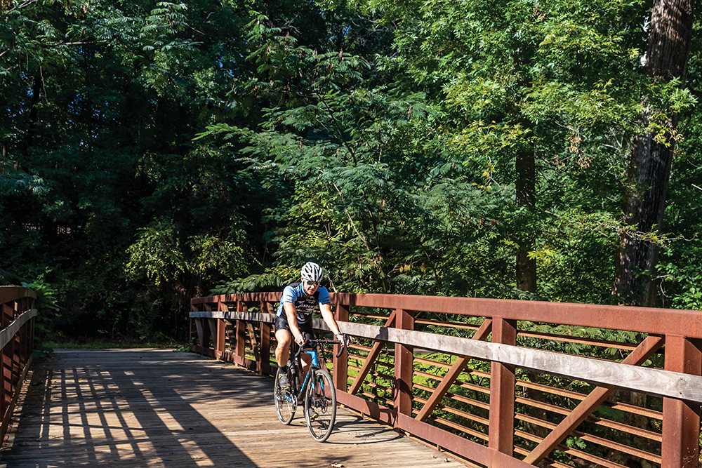 Salem Park, Winston Salem NC, David Amato cycling on the trail.