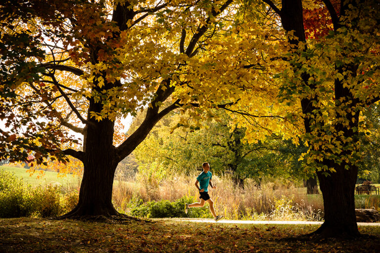 Man runs at Arboretum Park in Champaign, IL.