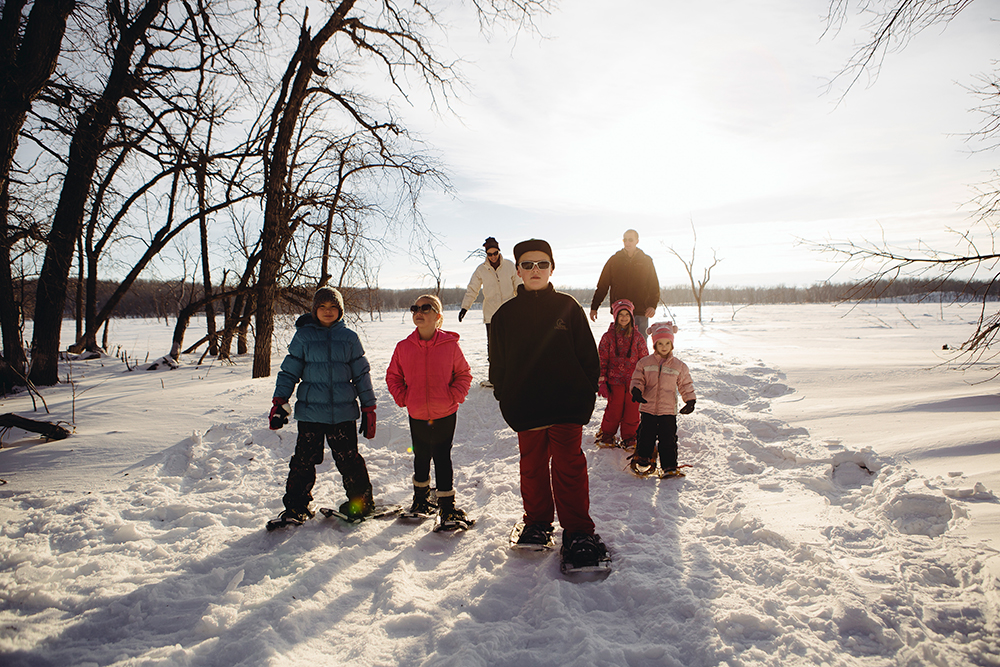 Family hike in winter at Devils Lake. Credit North Dakota Tourism