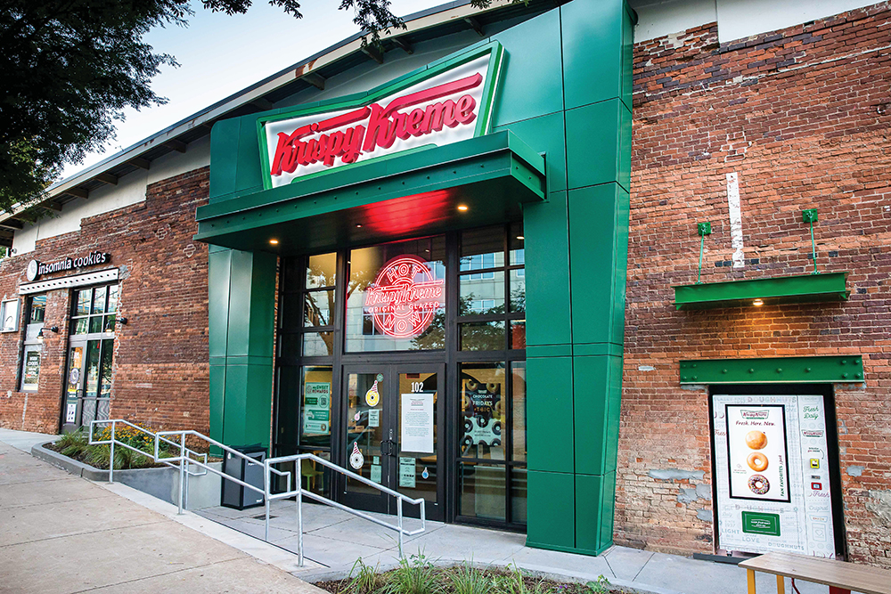 Exterior of a Krispy Kreme Doughnuts storefront in Winston-Salem, NC.