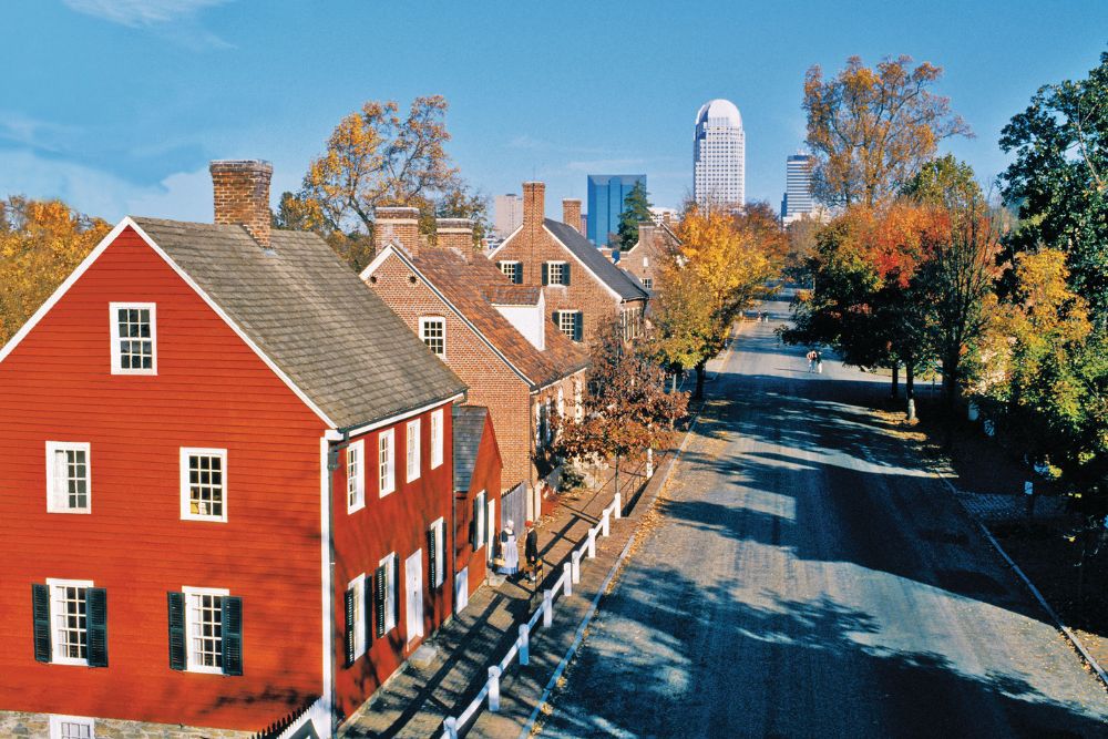 Old Salem faces the modern Winston-Salem skyline.