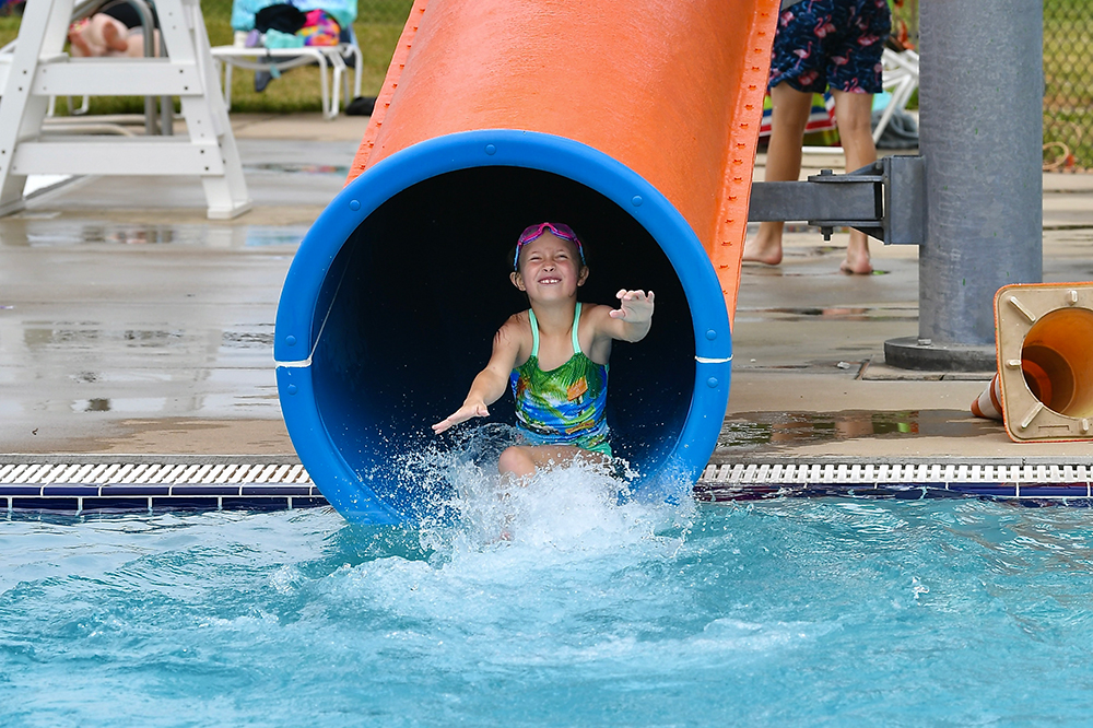 Child goes down a slide at a waterpark in New Castle, IN.
