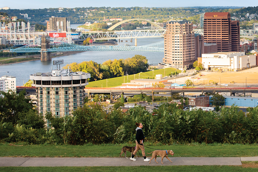 People watch the sunset over Covington and the Ohio River from Devou Park in Covington. Covington is part of the Northern Kentucky Region.