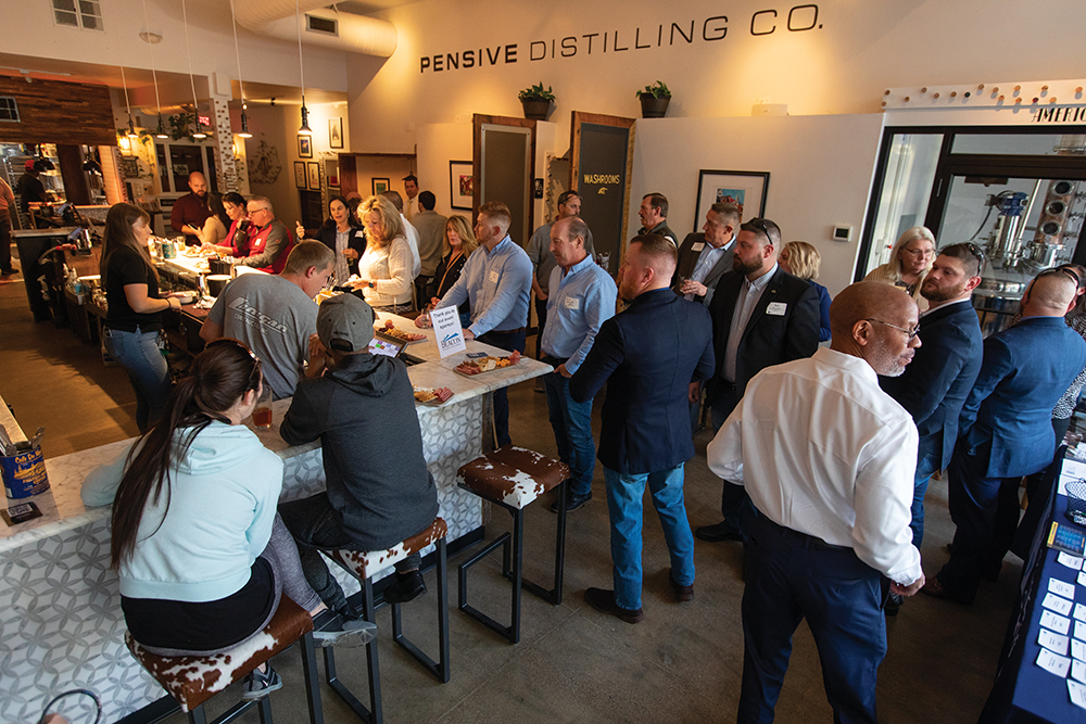 Guests network during the Business After Hours sponsored by Beacon Orthopaedics & Sports Medicine and hosted by the Nothern Kentucky Chamber of Commerce at Pensive Distilling in downtown Newport, Kentucky.