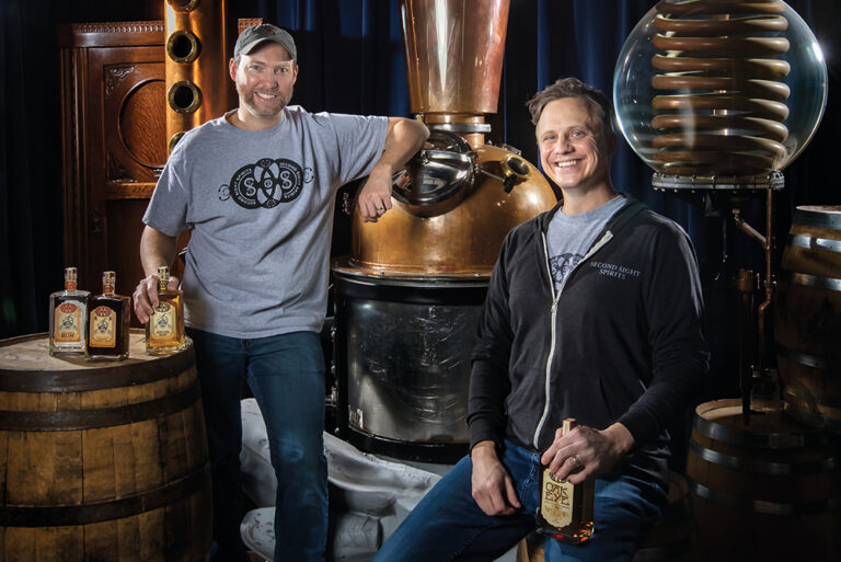 Rick Couch, left, and Carus Waggoner with their fortune teller themed custom distiller at Second Sight Spirits in Ludlow. Ludlow is a city located in the Northern Kentucky region.