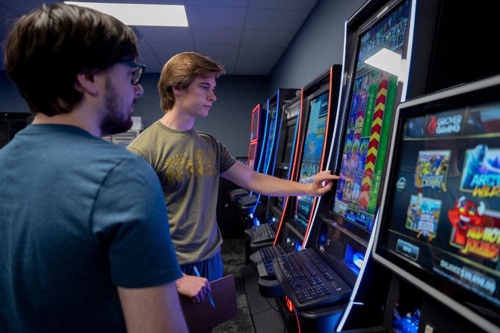 Men working on developing games for Grover Gaming in Greenville, NC.