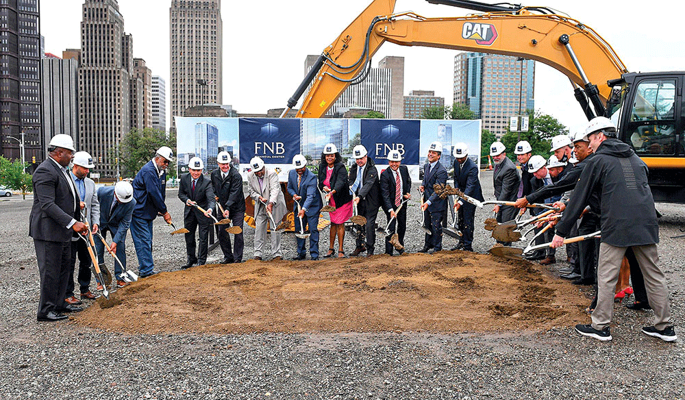 First National Bank breaks ground on its new headquarters.