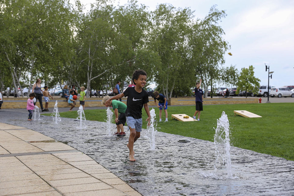 Children play in the fountains at one of the many parks and playgrounds you'll find in Bloomington, MN.