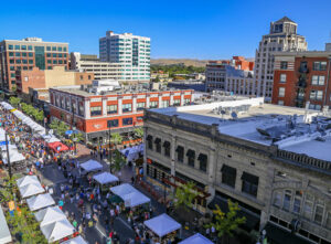 An aerial view of a street festival in downtown Boise, ID. Nicknamed the "City of Trees," Boise cherishes its outdoor amenities and the environment.