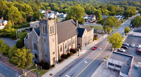 An aerial view of a church in Concord, N.C. at sunset. Located near Charlotte, Concord is the perfect blend of a quaint, southern town and an up-and-coming metropolis, making it one of the best places to live in the U.S.
