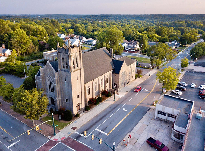 An aerial view of a church in Concord, N.C. at sunset. Located near Charlotte, Concord is the perfect blend of a quaint, southern town and an up-and-coming metropolis, making it one of the best places to live in the U.S.