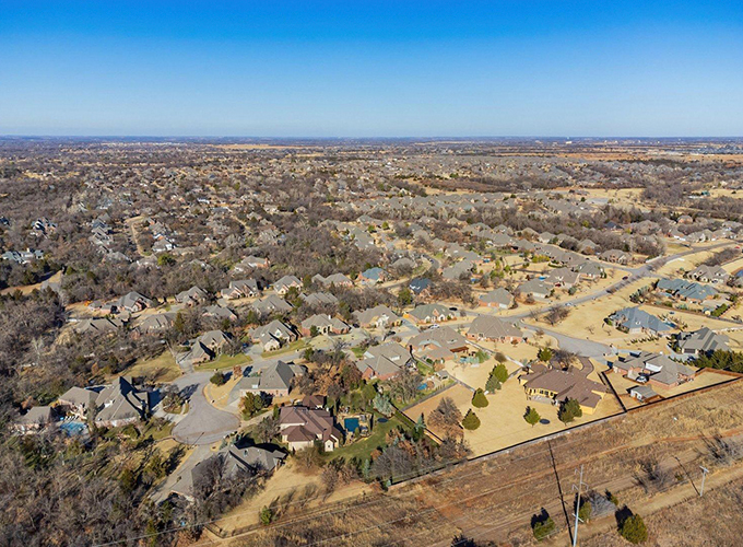 Aerial view of the cityscape around Mitch Park at Edmond, OK. Once considered a sleepy suburb of Oklahoma City, Edmond has carved out its own spot as one of the best places to live in the U.S.