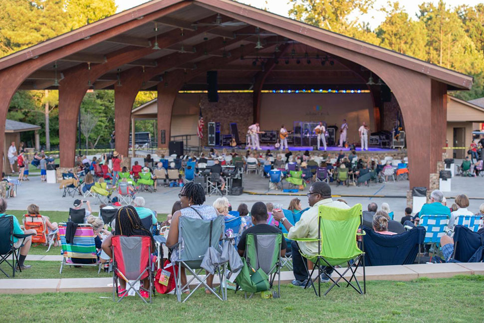 Audience members enjoy an outdoor concert at Newtown Park in Johns Creek, GA. Plentiful parks and outdoor recreation make Johns Creek one of the best places to live in the U.S.