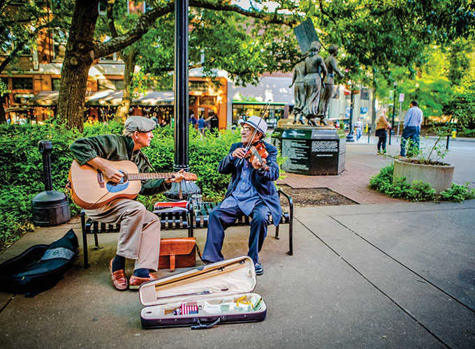 Musicians perform in Market Square in Knoxville, TN. Home to the University of Tennessee, a bustling revitalized downtown and bountiful outdoor activities, Knoxville is one of the best places to live in the U.S.