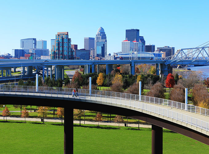 The Louisville, KY, skyline with pedestrian walkway in front. Louisville is well known for its bourbon, the Kentucky Derby and Louisville Slugger baseball bats, but it's also one of the best places to live in the U.S. in 2023.