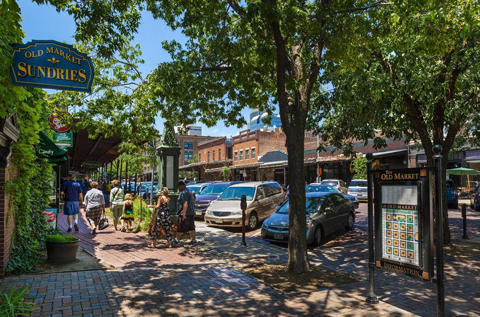 Shops, bars and restaurants line Howard Street in the historic Old Market district in Omaha, NE. With a low cost of living and high quality of life, Omaha is a magnet for young professionals and families looking to put down roots.