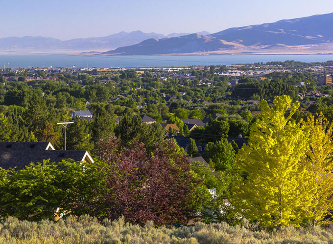 A view of Utah Lake and the mountains beyond from Orem, UT. Orem's nickname is “Family City USA,” a reputation solidified with its good schools, safe neighborhoods and kid-friendly amenities.