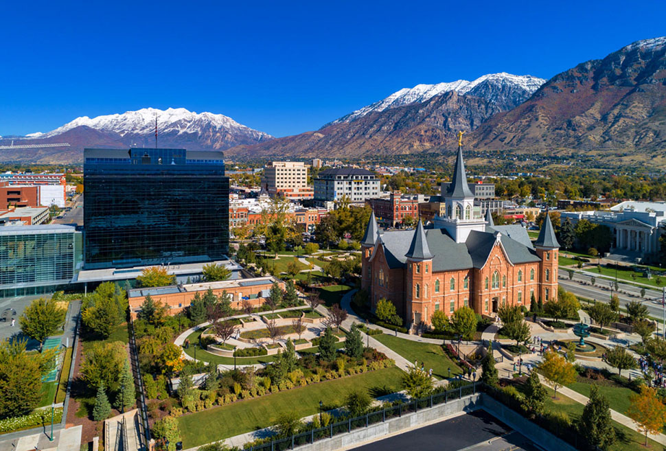 An aerial view of downtown Provo, UT, set against the Wasatch Mountains. While outdoor activities are a huge draw, downtown offers plenty of things to do, including museums, performances and local cuisine.