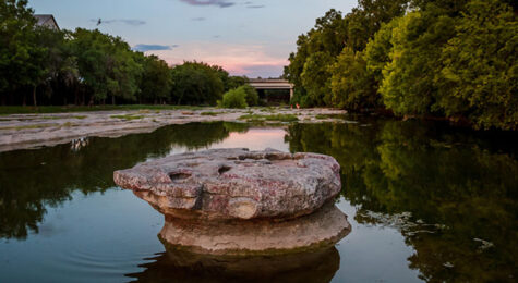 A view of the Round Rock in the middle of Brushy Creek for which Round Rock, TX, is named. The fast-growing suburb of Austin is one of the best places to live in the US in 2023.