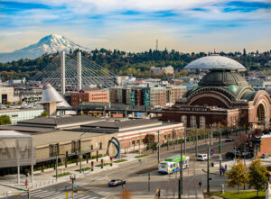 An aerial view of downtown Tacoma, WA. Tacoma's location on the banks of Puget Sound gives residents easy access to outdoor activities such as boating, fishing, swimming, hiking and biking.
