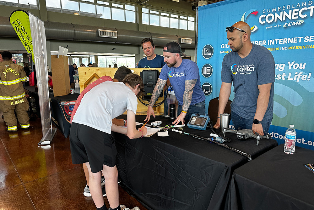 Cumberland Connect employees teach students about fiber splicing at the CMCSS Career Fair in Clarksville.
