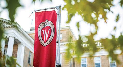 A W crest banner on Bascom Hill is pictured among the colors of the fall leaves at the University of Wisconsin-Madison during autumn on November 8, 2021. (Photo by Bryce Richter / UW-Madison)