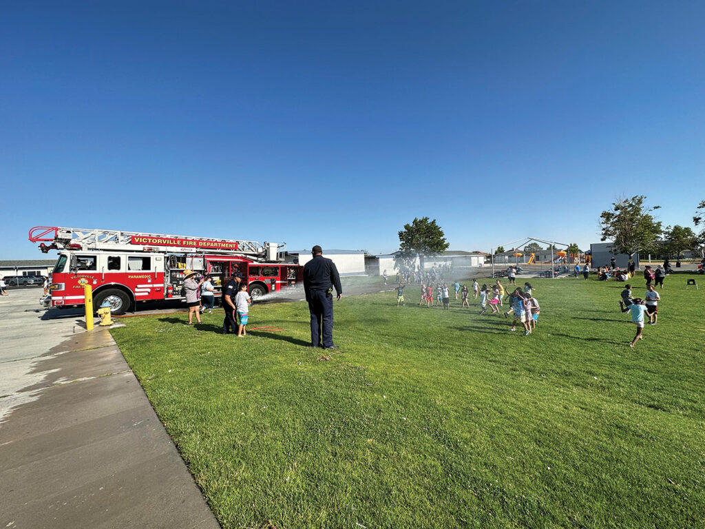 Summer school water day with firetruck